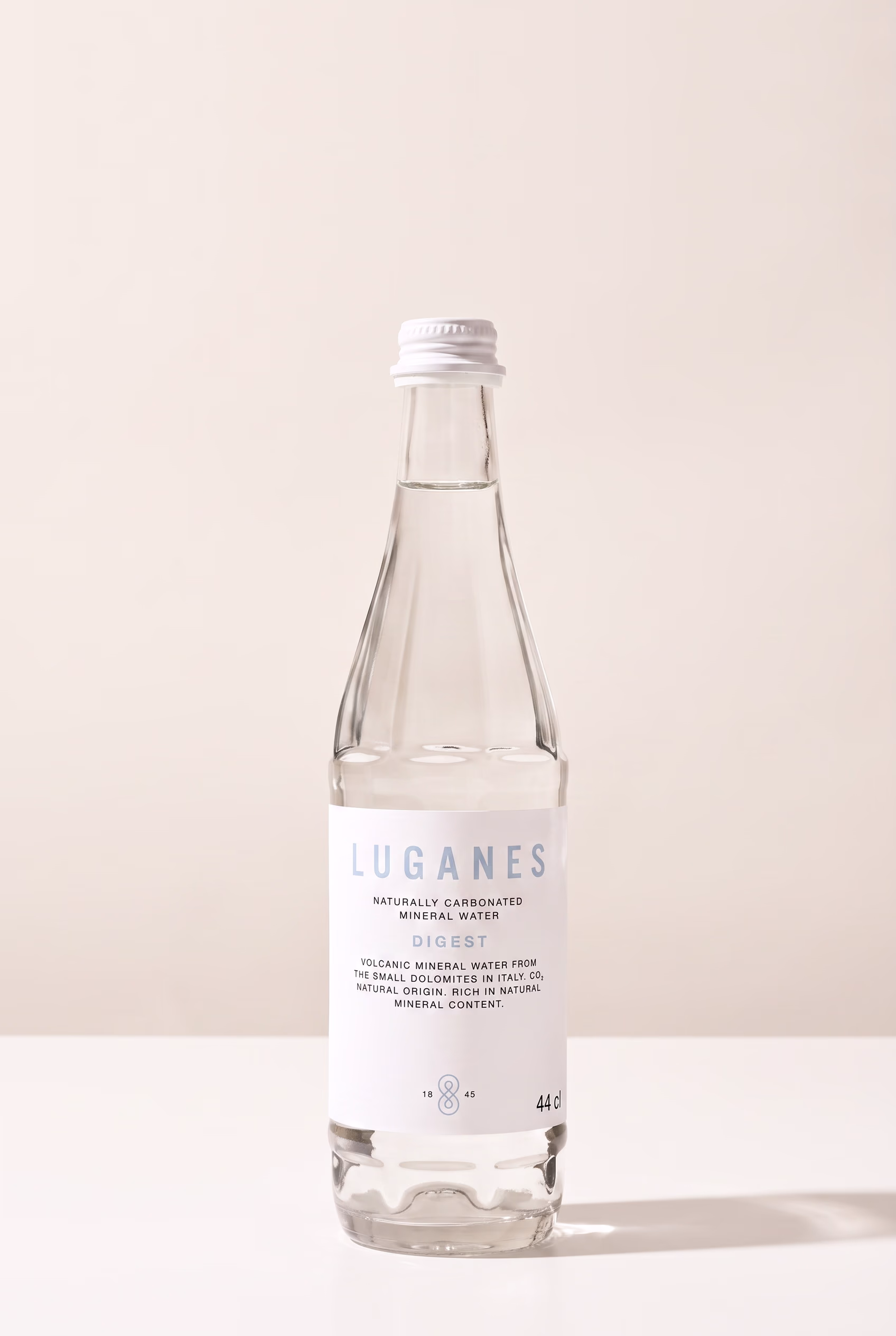 LUGANES Digest bottle on white with a deeper shadow and gold label detail