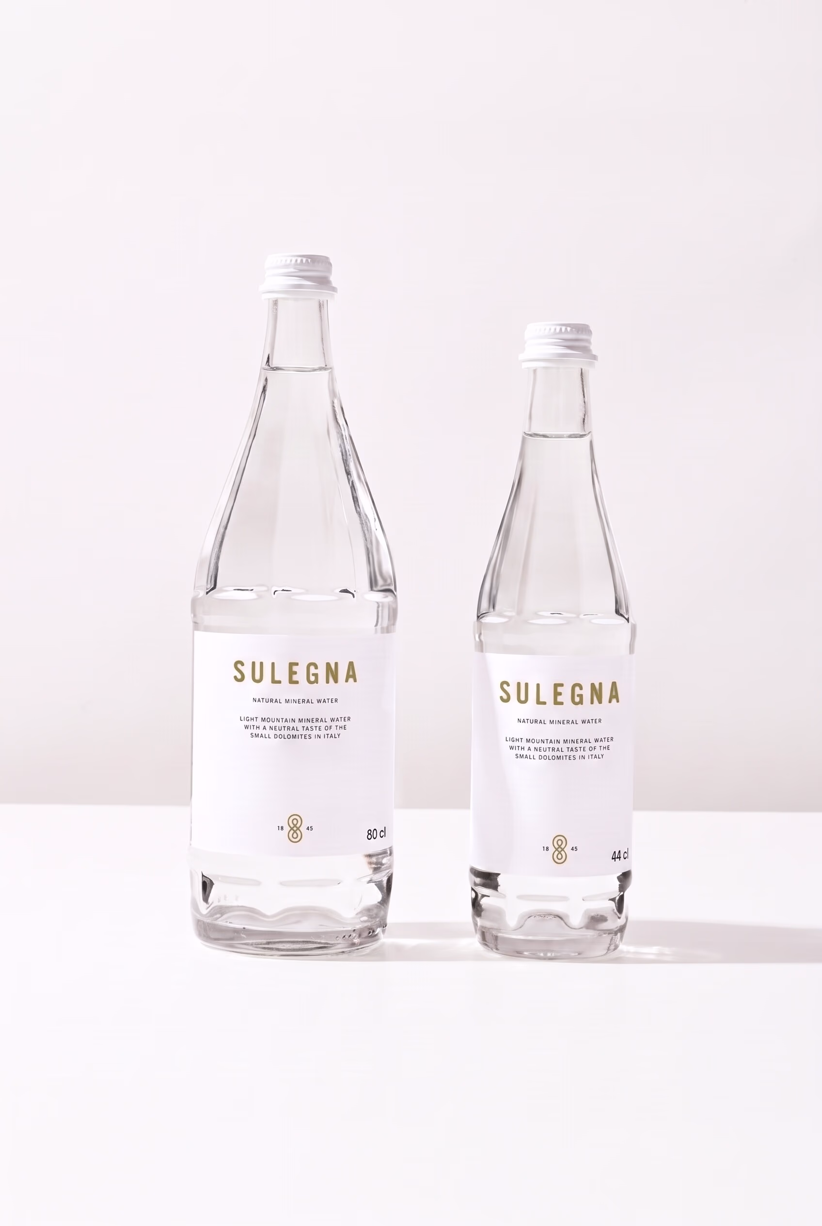 SULEGNA Natural bottles, 80 cl and 44 cl, side by side on white