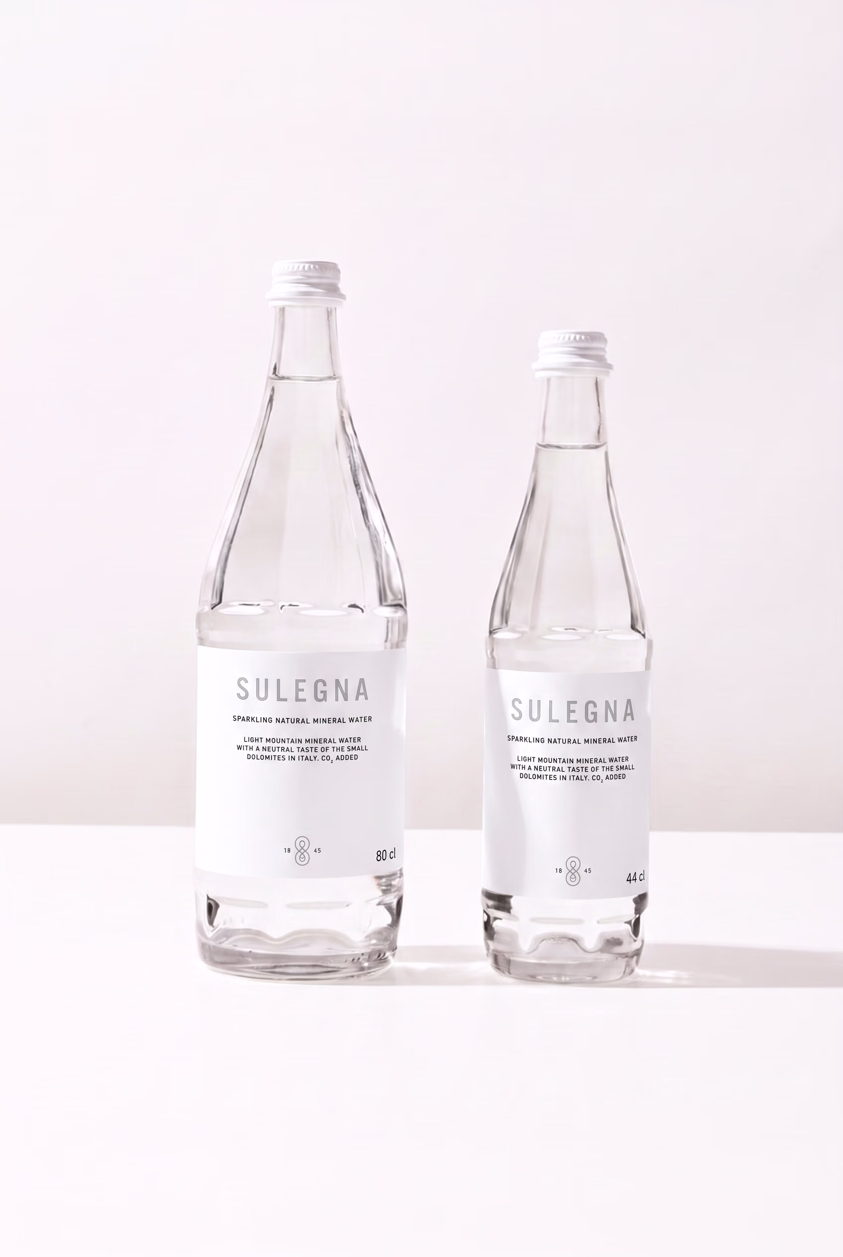 SULEGNA Sparkling bottles, 80 cl and 44 cl, side by side on white
