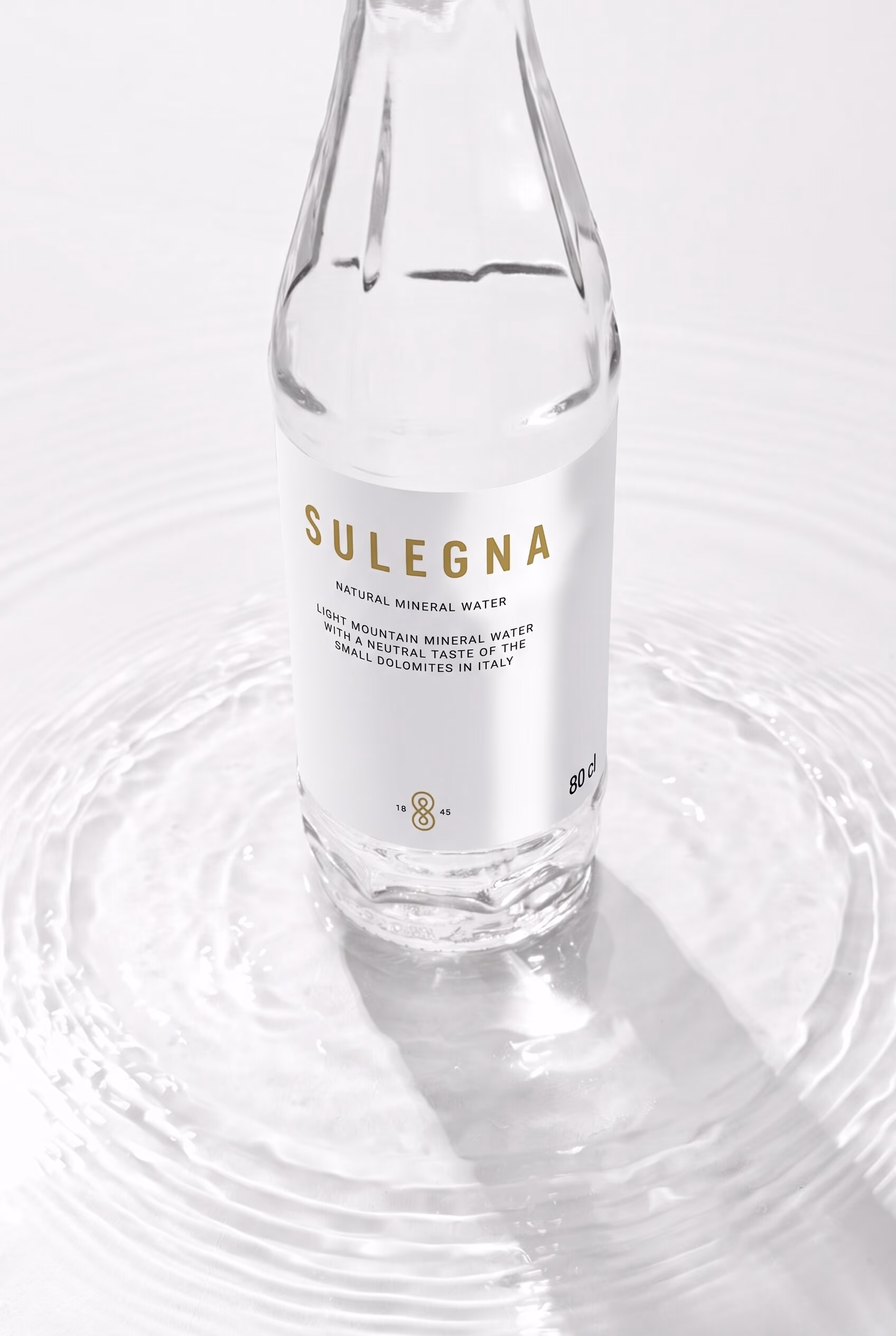 Macro of glass texture and bottle shoulder with light refraction